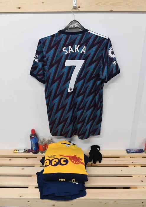 Framed Print : Arsenal's Bukayo Saka Jersey in Leeds United's Changing Room - Premier League Clash (2021-22)