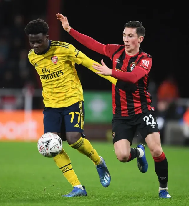 Framed Print : Arsenal's Bukayo Saka Outmaneuvers Bournemouth's Harry Wilson in FA Cup Fourth Round Clash Framed Print : Arsenal's Bukayo Saka Outmaneuvers Bournemouth's Harry Wilson in FA Cup Fourth Round Clash