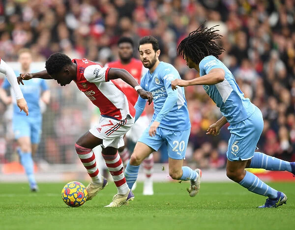 Arsenal's Bukayo Saka Outmaneuvers Manchester City's Nathan Ake in Premier League Clash