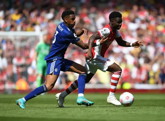 Framed Print : Arsenal's Bukayo Saka Outwits Junior Firpo in Premier League's Thrilling Showdown Framed Print : Arsenal's Bukayo Saka Outwits Junior Firpo in Premier League's Thrilling Showdown