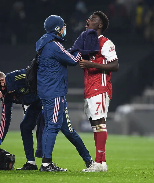 Arsenal's Bukayo Saka Receives Medical Attention During Tottenham Match, 2020-21 Premier League
