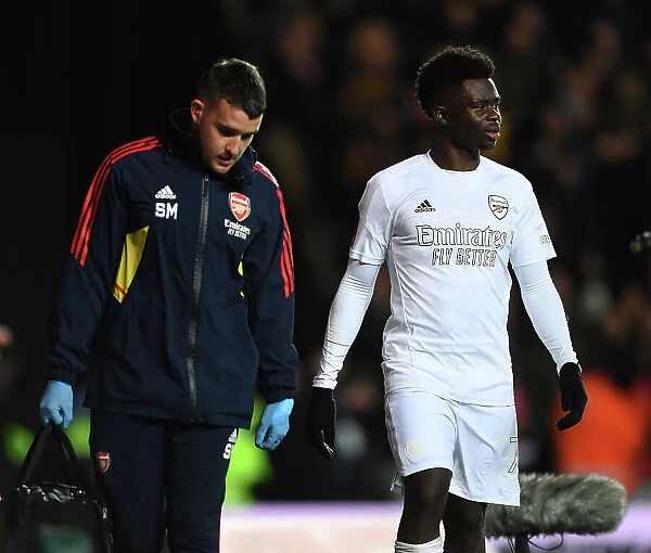 Arsenal's Bukayo Saka Receives Medical Treatment from Physio during FA Cup Match against Oxford United