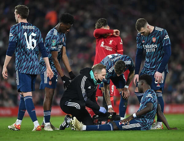 Arsenal's Bukayo Saka Receives Treatment from Physio During Liverpool vs Arsenal Carabao Cup Semi-Final