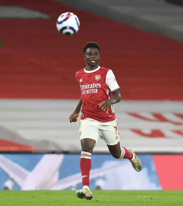 Framed Print : Arsenal's Bukayo Saka Shines in Empty Emirates: Premier League 2020-21 (Arsenal v Manchester City)