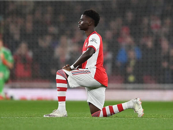 Arsenal's Bukayo Saka Takes a Knee during Arsenal v Crystal Palace, Premier League 2021-22