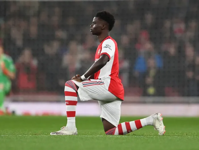 Framed Print : Arsenal's Bukayo Saka Takes a Knee during Arsenal v Crystal Palace, Premier League 2021-22
