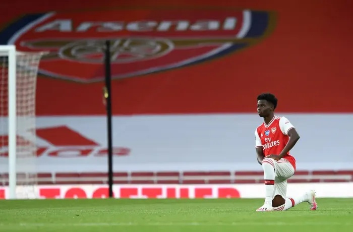Framed Print : Arsenal's Bukayo Saka Takes a Knee at Empty Emirates Stadium During Arsenal v Liverpool Match, 2019-2020 Premier League Framed Print : Arsenal's Bukayo Saka Takes a Knee at Empty Emirates Stadium During Arsenal v Liverpool Match, 2019-2020 Premier League
