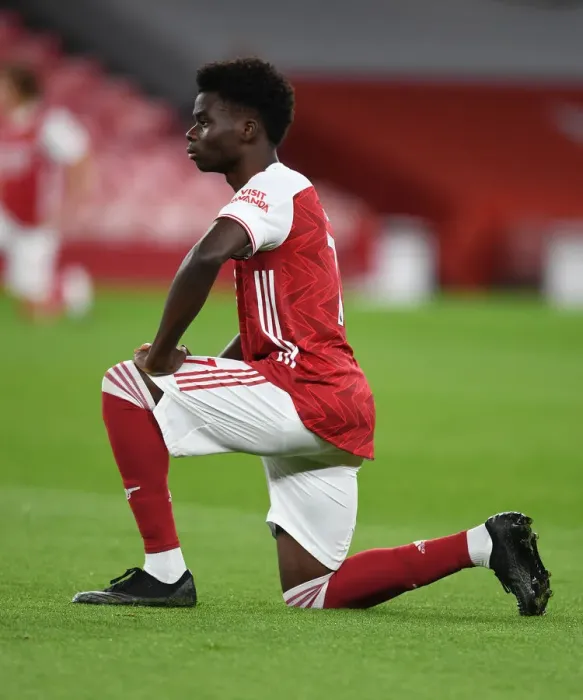Framed Print : Arsenal's Bukayo Saka Takes a Knee during Emirates Stadium's Empty Ranks: Arsenal v Leicester City, 2020-21 Premier League Framed Print : Arsenal's Bukayo Saka Takes a Knee during Emirates Stadium's Empty Ranks: Arsenal v Leicester City, 2020-21 Premier League