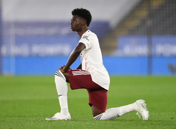 Framed Print : Arsenal's Bukayo Saka Takes a Knee During Leicester City vs Arsenal Carabao Cup Match Framed Print : Arsenal's Bukayo Saka Takes a Knee During Leicester City vs Arsenal Carabao Cup Match