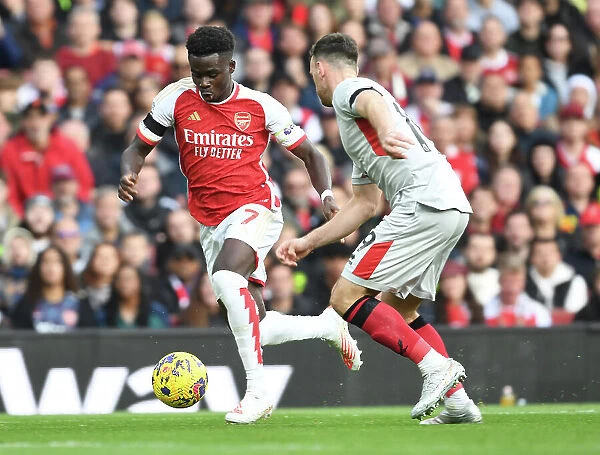 Arsenal's Bukayo Saka Takes on Sheffield United's Jack Robinson in 2023-24 Premier League Clash