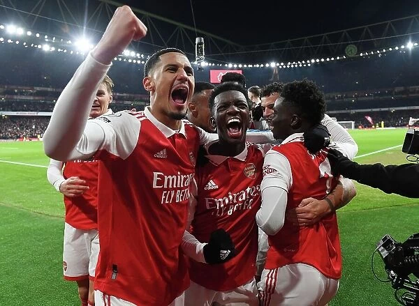 Arsenal's Bukayo Saka, Willam Saliba, and Eddie Nketiah Celebrate Goals Against Manchester United (2022-23)