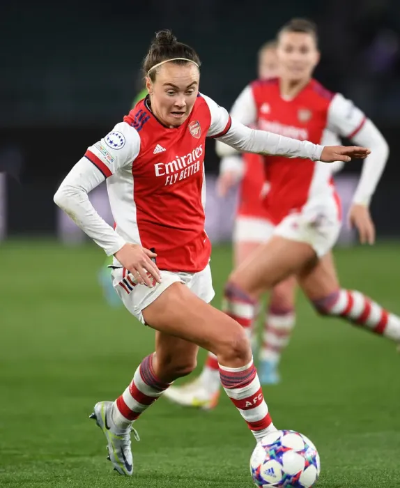 Framed Print : Arsenal's Caitlin Foord Fights for Victory in Champions League Quarterfinal Clash against VfL Wolfsburg