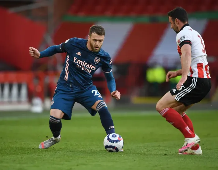 Framed Print : Arsenal's Calum Chambers Faces Off Against Sheffield United's Enda Stevens in Empty Bramall Lane - Premier League Clash 2021 Framed Print : Arsenal's Calum Chambers Faces Off Against Sheffield United's Enda Stevens in Empty Bramall Lane - Premier League Clash 2021