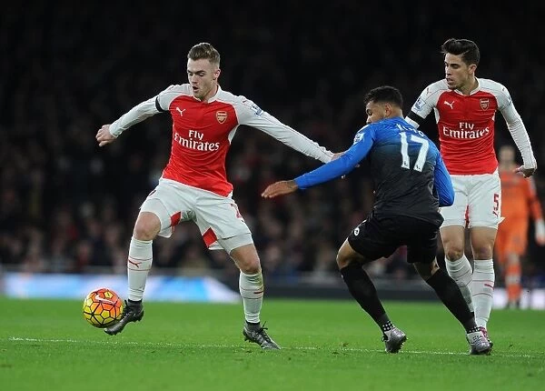 Arsenal's Calum Chambers Fends Off Bournemouth's Joshua King During Intense Premier League Clash