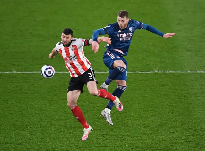 Framed Print : Arsenal's Calum Chambers Fights for Control Against Sheffield United in Premier League Clash