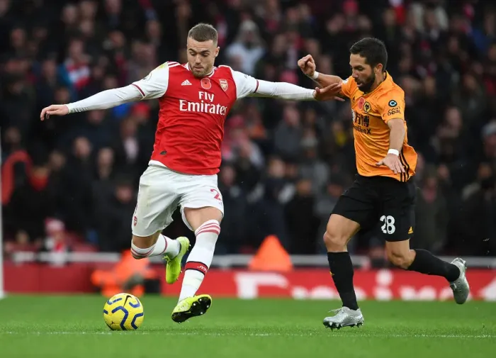 Framed Print : Arsenal's Calum Chambers Outmaneuvers Joao Moutinho in Premier League Clash vs. Wolverhampton Wanderers Framed Print : Arsenal's Calum Chambers Outmaneuvers Joao Moutinho in Premier League Clash vs. Wolverhampton Wanderers