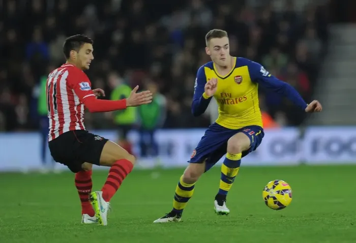 Framed Print : Arsenal's Calum Chambers Outmaneuvers Southampton's Dusan Tadic in Premier League Clash