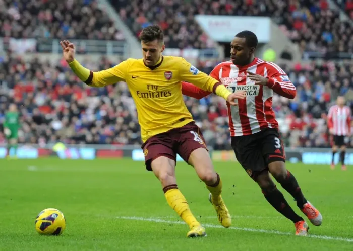 Framed Print : Arsenal's Carl Jenkinson Fends Off Sunderland's Danny Rose
