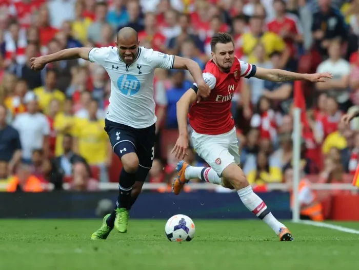 Framed Print : Arsenal's Carl Jenkinson Outmaneuvers Tottenham's Sandro in Premier League Clash