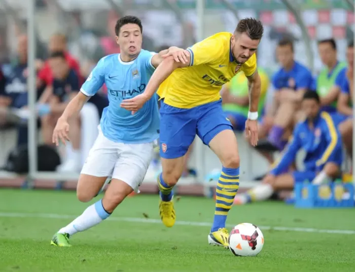 Framed Print : Arsenal's Carl Jenkinson Stands Strong Against Samir Nasri in Pre-Season Showdown