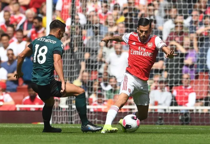 Framed Print : Arsenal's Ceballos Clashes with Burnley's Westwood in Premier League Showdown