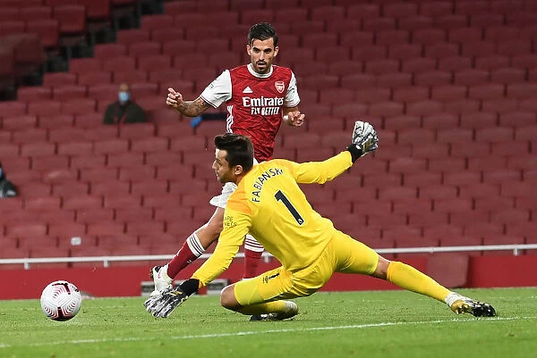 Arsenal's Ceballos Outmaneuvers West Ham's Fabianski in Premier League Clash