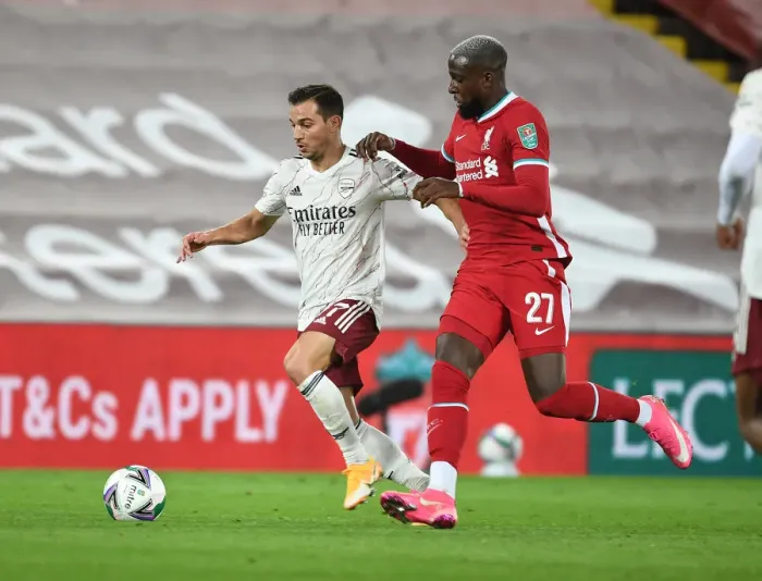 Framed Print : Arsenal's Cedric Battles Past Liverpool's Origi in Empty Anfield - Carabao Cup 2020-21