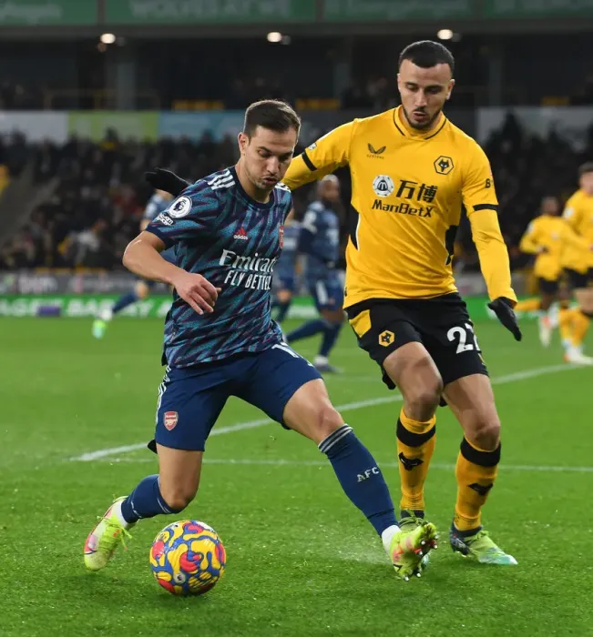 Framed Print : Arsenal's Cedric Clashes with Wolves Romain Saiss in Premier League Showdown Framed Print : Arsenal's Cedric Clashes with Wolves Romain Saiss in Premier League Showdown