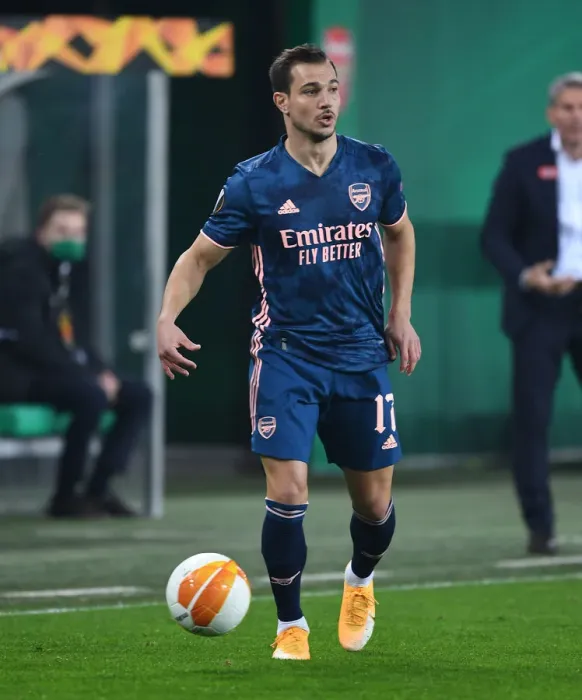 Framed Print : Arsenal's Cedric Faces Off Against Rapid Vienna in Europa League Clash Framed Print : Arsenal's Cedric Faces Off Against Rapid Vienna in Europa League Clash
