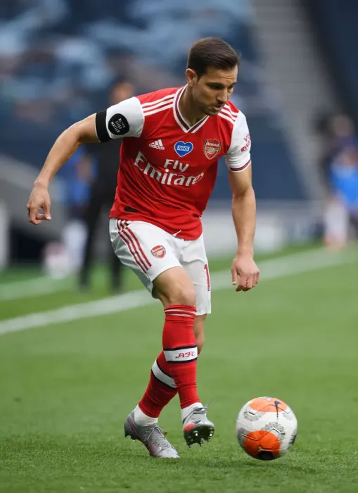 Framed Print : Arsenal's Cedric Faces Off Against Tottenham in Premier League Clash