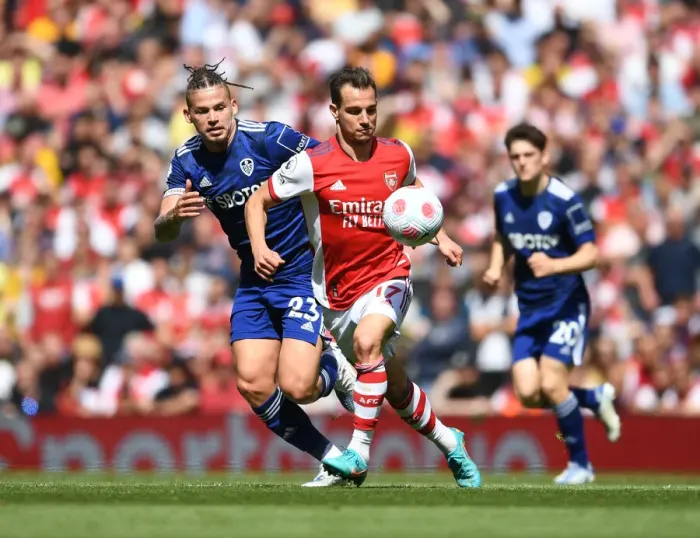 Framed Print : Arsenal's Cedric Outpaces Phillips: Thrilling Moment from Arsenal vs Leeds United Premier League Clash Framed Print : Arsenal's Cedric Outpaces Phillips: Thrilling Moment from Arsenal vs Leeds United Premier League Clash