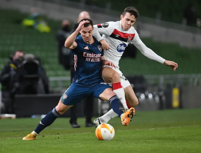 Framed Print : Arsenal's Cedric Overpowers Dundalk's James Wynne in UEFA Europa League Clash Framed Print : Arsenal's Cedric Overpowers Dundalk's James Wynne in UEFA Europa League Clash