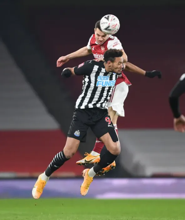 Framed Print : Arsenal's Cedric Soars Above Joelinton in FA Cup Clash: Arsenal vs. Newcastle United (2020-21) Framed Print : Arsenal's Cedric Soars Above Joelinton in FA Cup Clash: Arsenal vs. Newcastle United (2020-21)
