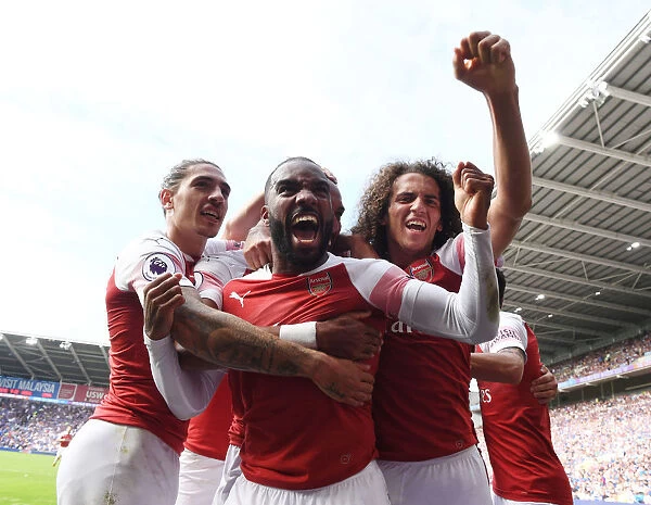 Arsenal's Celebrating Trio: Aubameyang, Lacazette, and Guendouzi at Cardiff City Stadium