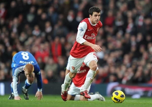 Arsenal's Cesc Fabregas Scores Against Ben Watson, Leading Arsenal to 3-0 Victory over Wigan Athletic in the Premier League