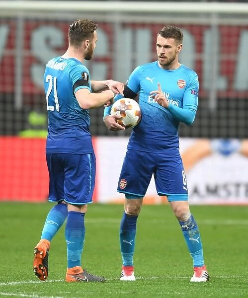 Arsenal's Chambers and Ramsey Face Off Against AC Milan in Europa League