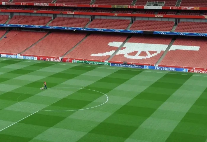Framed Print : Arsenal's Champions League Preparation: Marking the Emirates Pitch for Arsenal vs. Besiktas (2014)