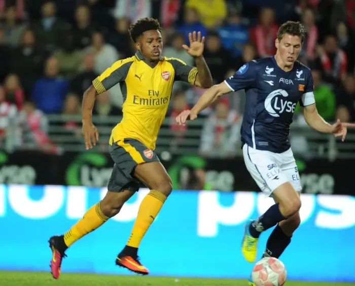 Framed Print : Arsenal's Chuba Akpom Goes Head-to-Head with Erik Steen in Viking Friendly Clash