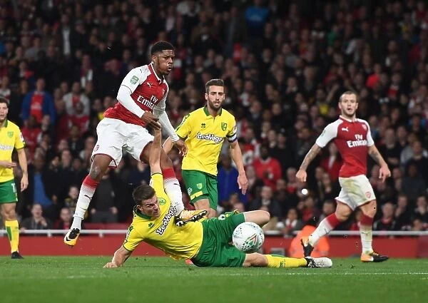 Arsenal's Chuba Akpom Tries to Shoot Past Norwich's Christoph Zimmermann in Carabao Cup Clash
