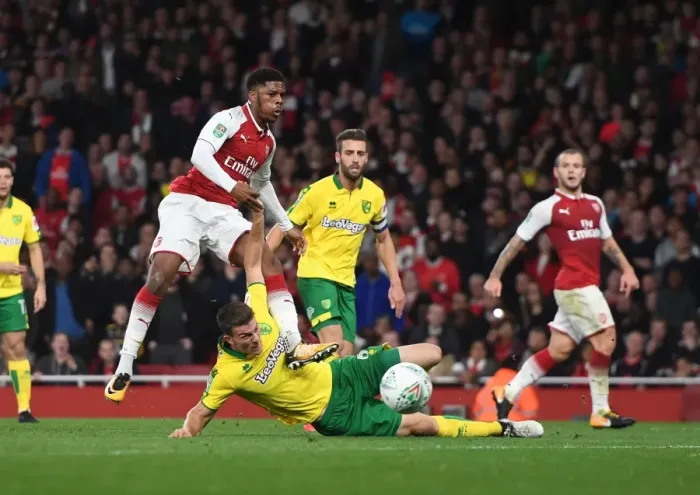 Framed Print : Arsenal's Chuba Akpom Tries to Shoot Past Norwich's Christoph Zimmermann in Carabao Cup Clash