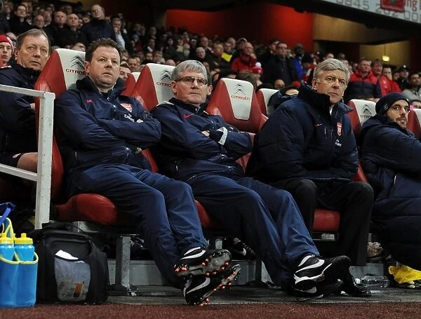 Arsenal's Coach Trio: Wenger, Rice, and Lewin during the 2011-2012 Arsenal vs. Wolverhampton Wanderers Match