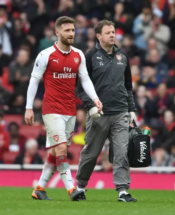 Framed Print : Arsenal's Colin Lewin Tends to Injured Shkodran Mustafi vs. Watford (2017-18)