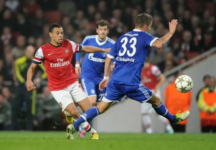 Framed Print : Arsenal's Coquelin Clashes with Schalke's Neustadter in Champions League Showdown Framed Print : Arsenal's Coquelin Clashes with Schalke's Neustadter in Champions League Showdown