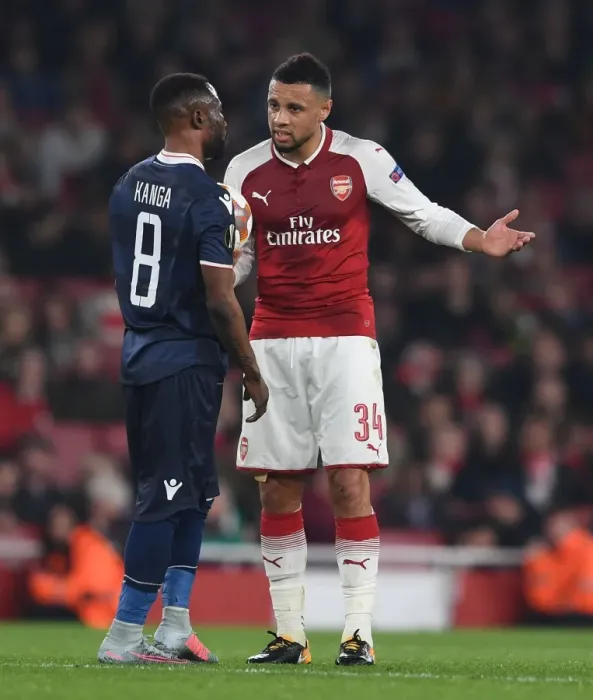 Framed Print : Arsenal's Coquelin Engages with Red Star's Kanga during Europa League Clash