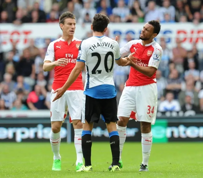Framed Print : Arsenal's Coquelin and Koscielny in Deep Discussion with Newcastle's Thauvin during 2015-16 Premier League Clash Framed Print : Arsenal's Coquelin and Koscielny in Deep Discussion with Newcastle's Thauvin during 2015-16 Premier League Clash