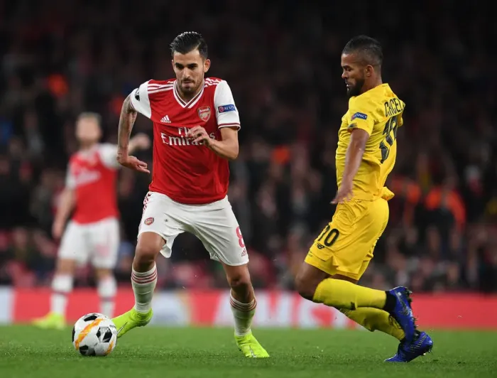 Framed Print : Arsenal's Dani Ceballos Breaks Past Standard Liege's Mehdi Carcela in Europa League Clash