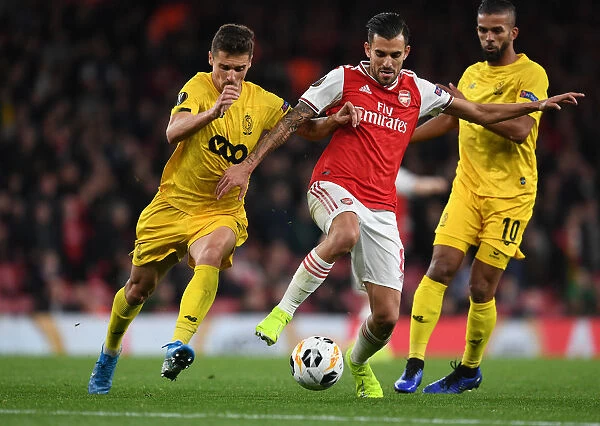 Arsenal's Dani Ceballos Clashes with Standard Liege's Aleksander Boljevic in Europa League Showdown