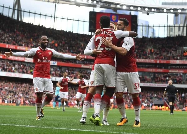 Arsenal's Danny Welbeck, Alex Lacazette, and Sead Kolasinac Celebrate Goals Against AFC Bournemouth