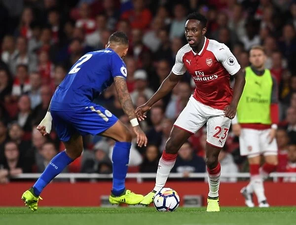 Arsenal's Danny Welbeck Clashes with Leicester's Danny Simpson in Premier League Showdown