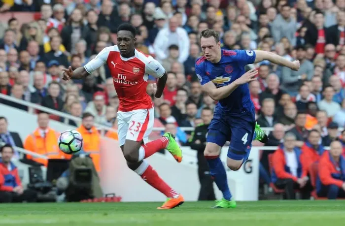 Framed Print : Arsenal's Danny Welbeck Clashes with Manchester United's Phil Jones in Premier League Showdown Framed Print : Arsenal's Danny Welbeck Clashes with Manchester United's Phil Jones in Premier League Showdown